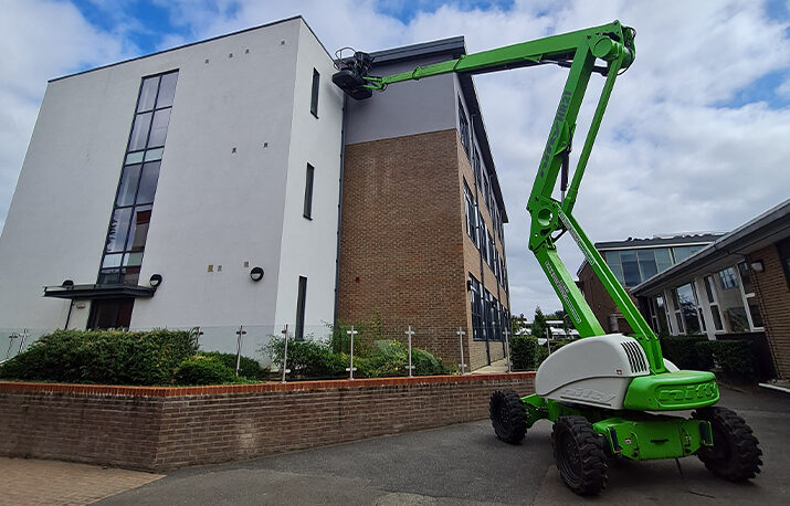 gutter clearing with machine for high level building